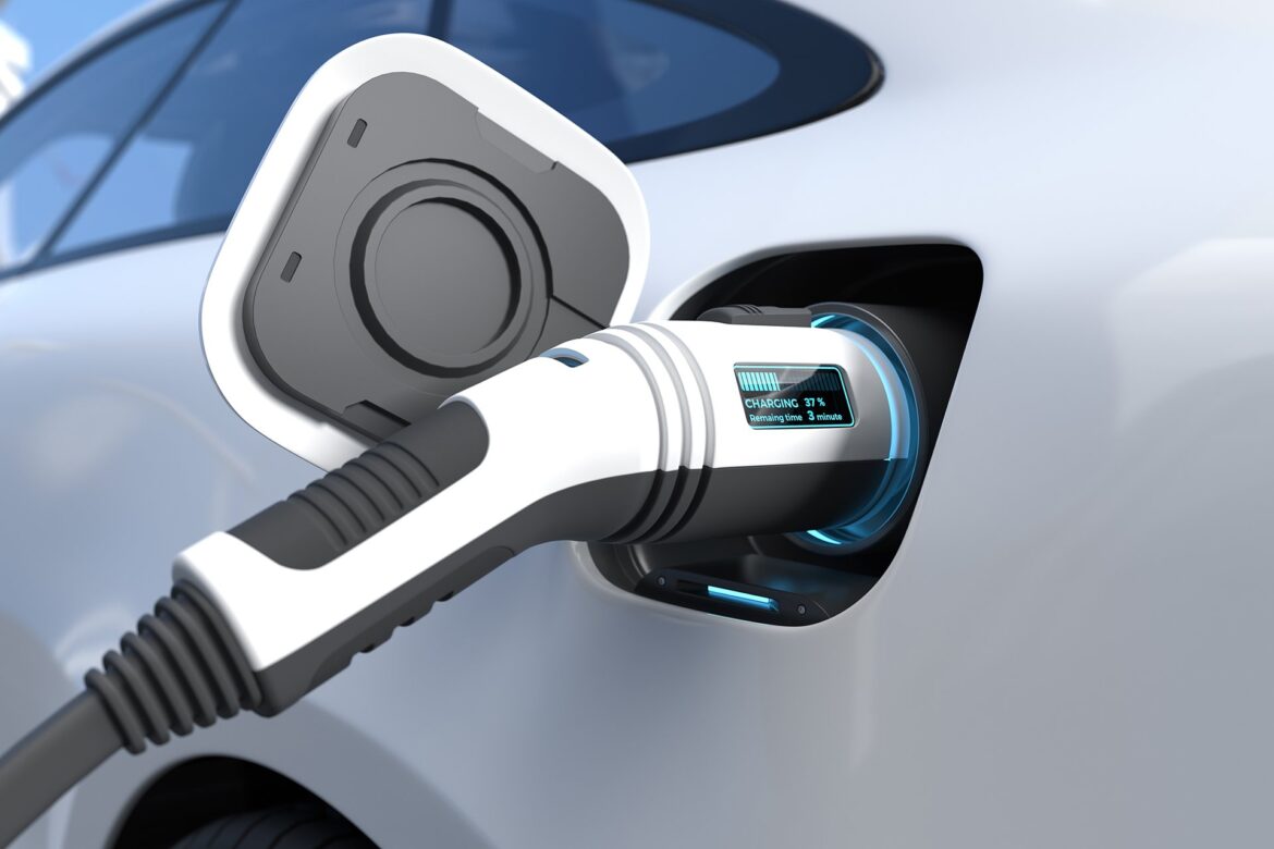 Electric car is charging the battery at the Ev charging station.